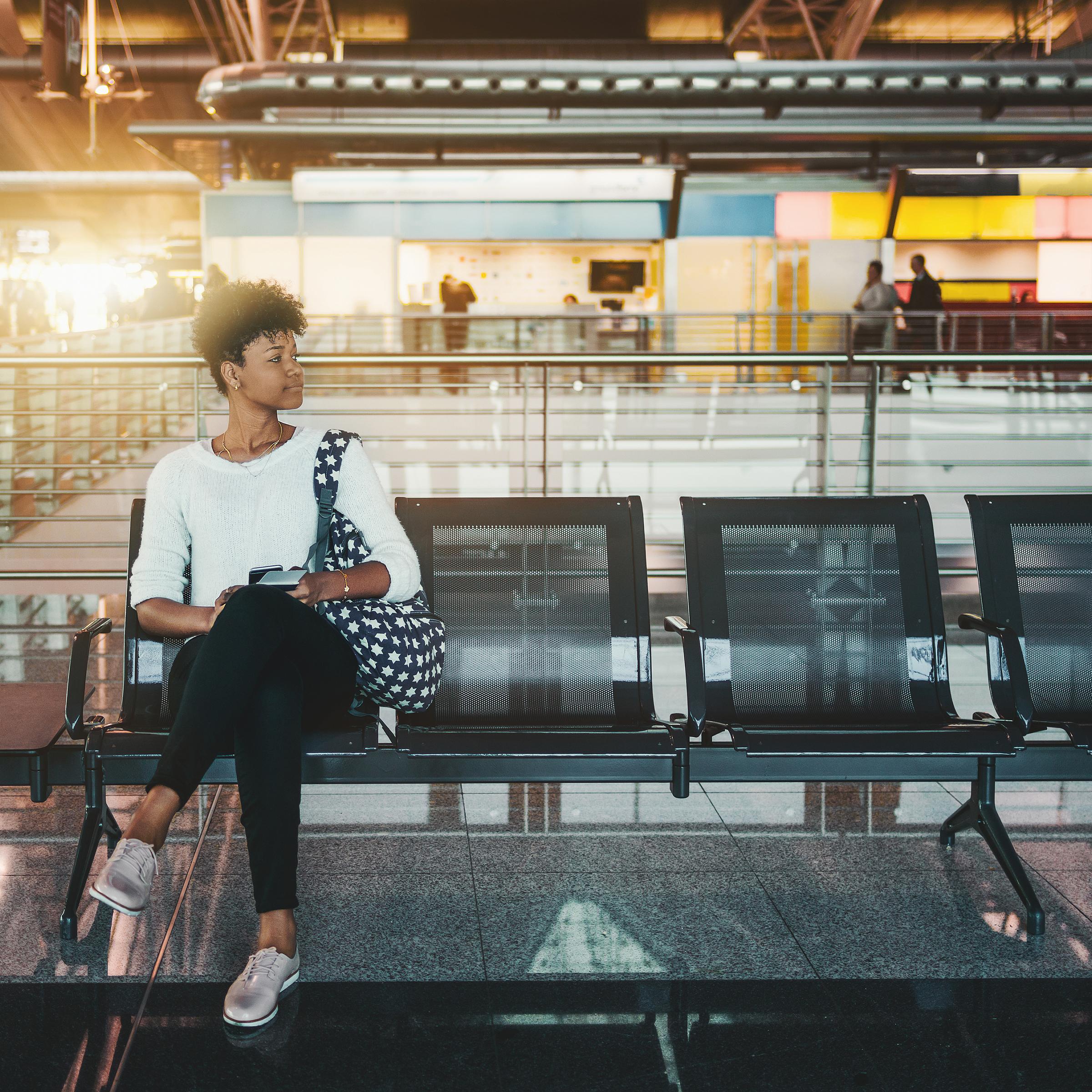 Woman sitting in transit center