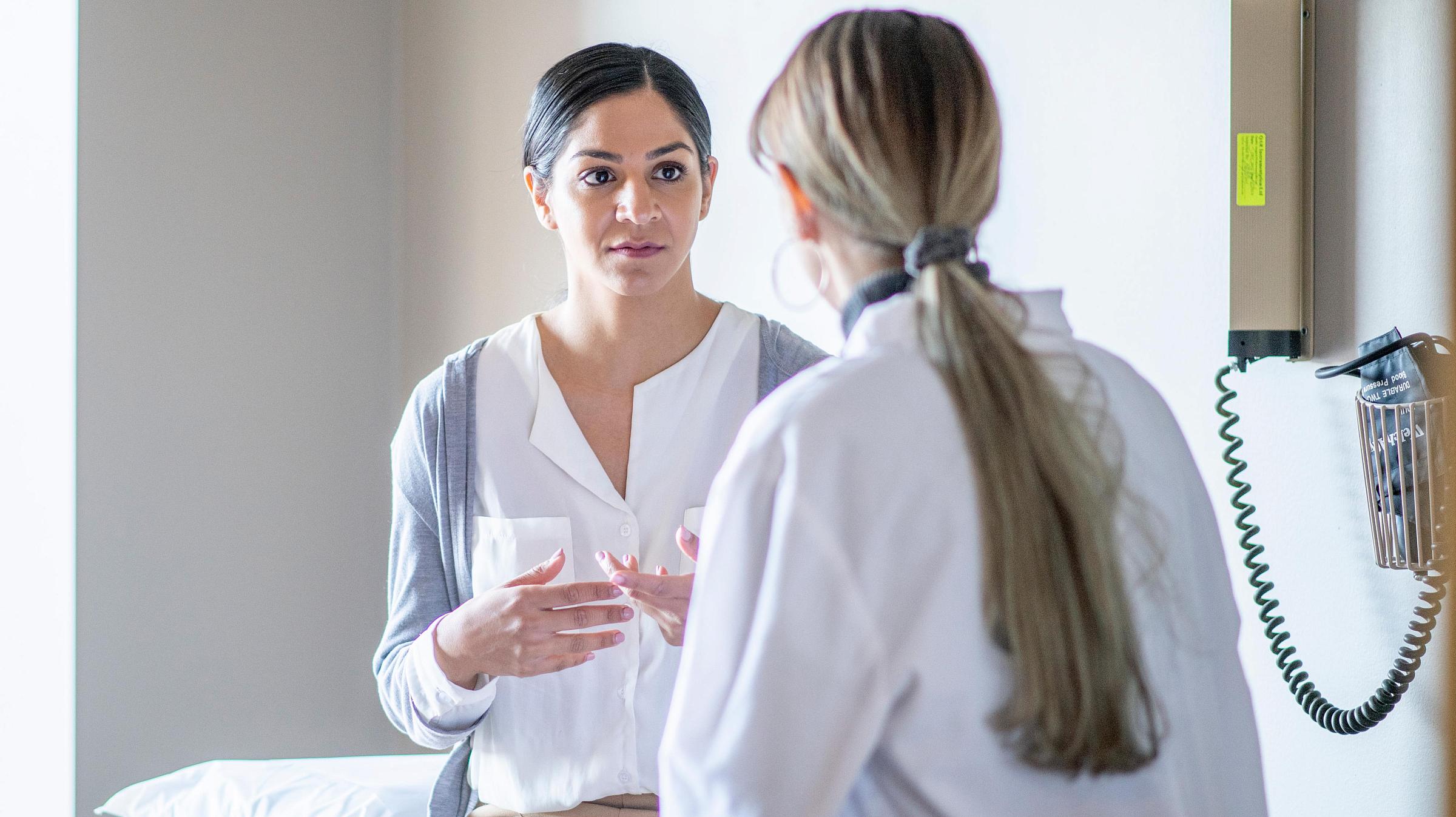 Female patient talking to female doctor
